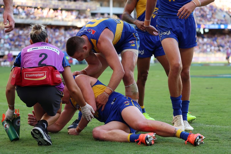 Elliot Yeo helps Harley Reid up following the hit.