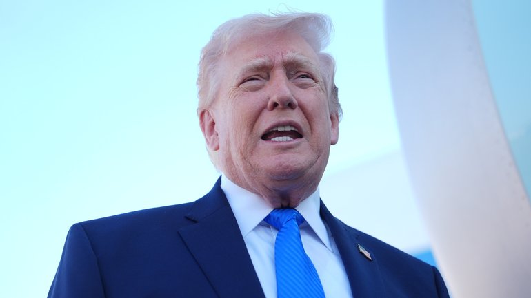 President Donald Trump speaks with the media before boarding Air Force One.
