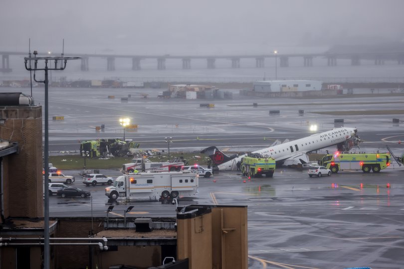 An Air Canada Express plane with 76 people aboard collided with a fire truck shortly after landing at New York's LaGuardia Airport late Sunday, killing the two pilots. 
