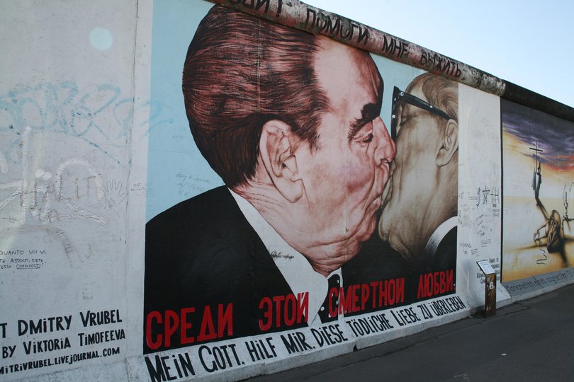 Mural painting portraying the kiss between communist leaders Leonid Brezhnev and Erich Honeckeron, on the Berlin wall.