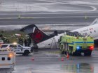 Emergency crews respond to an Air Canada Express plane on the tarmac after the plane collided with a fire truck at LaGuardia Airport (LGA) in the Queens borough of New York, US, on Monday, March 23, 2026. An Air Canada Express plane with 76 people aboard collided with a fire truck shortly after landing at New York's LaGuardia Airport late Sunday, killing the two pilots. Photographer: Michael Nagle/Bloomberg Michael Nagle