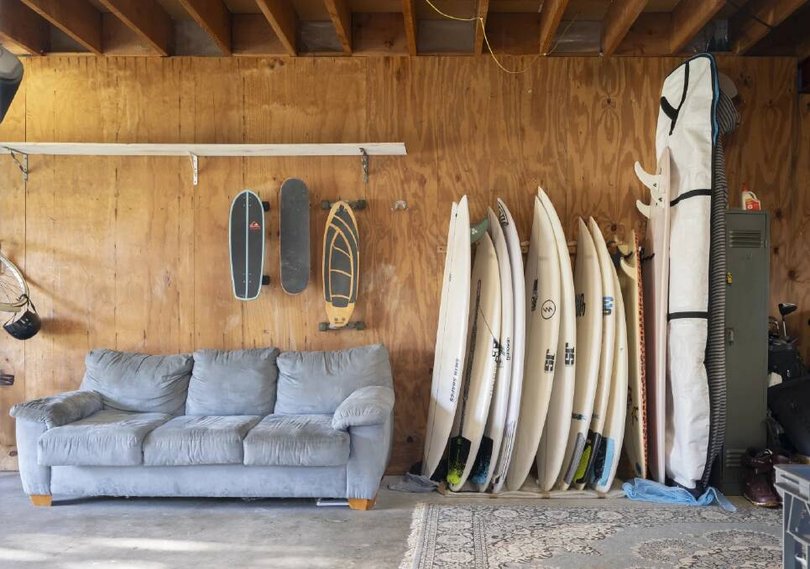 The garage has plenty of space to store surfboards.