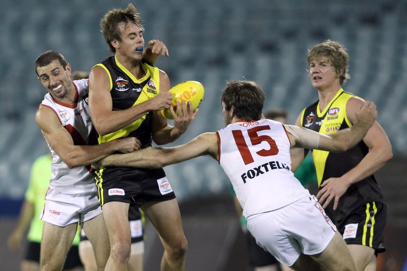 Leigh Ryswyk (far left) only played one AFL game but later became a champion of North Adelaide in the SANFL.