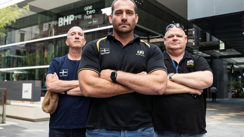 Electrical Trades Union Secretary Adam Woodage speaks to the media on Thursday outside BHP HQ. 
