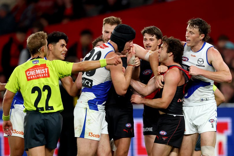 Tristan Xerri wipes the blood from his nose on Andy McGrath.