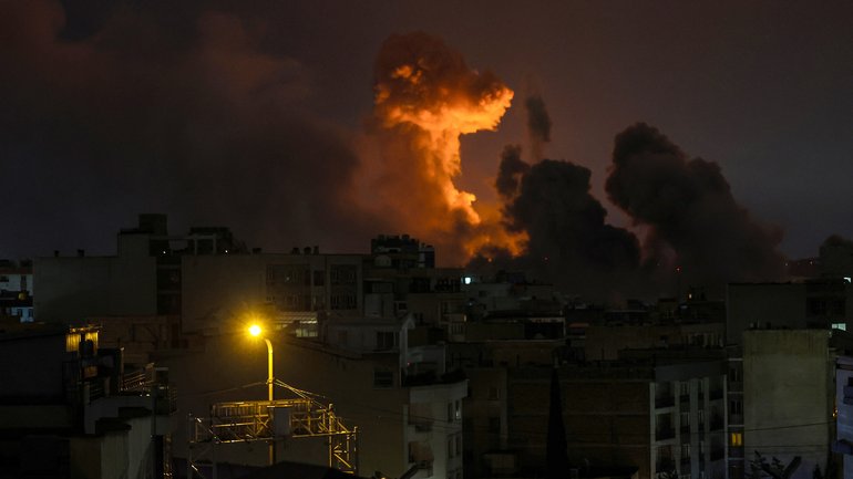 A large plume of smoke rises over Tehran after explosions were reported in the city during the night on March 28, 2026 in Tehran, Iran. 