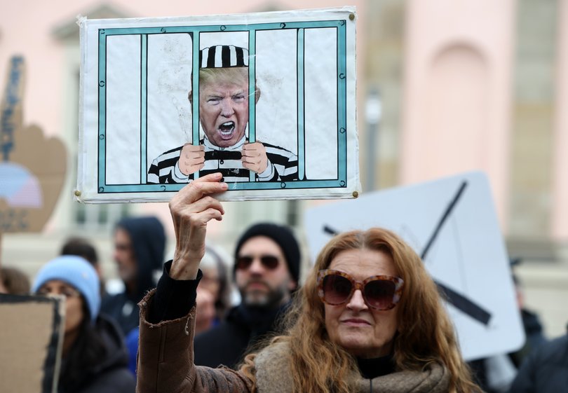 Activists attend a "No Kings" protest against the current US federal government on March 28, 2026 in Berlin, Germany.