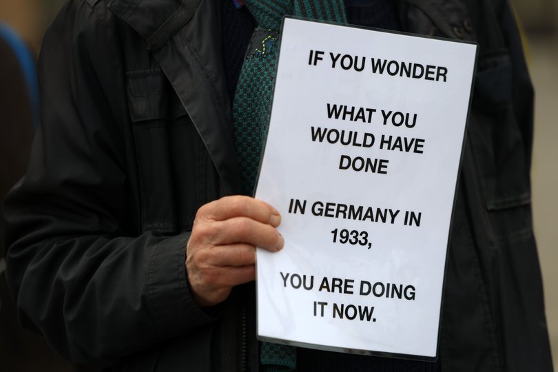 An activist attends a "No Kings" protest against the current U.S. federal government on March 28, 2026 in Berlin, Germany. (Photo by Adam Berry/Getty Images)