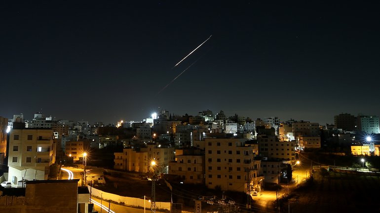 Missiles fired from Iran toward Israel are seen in the skies over Hebron, West Bank on March 24, 2026. 