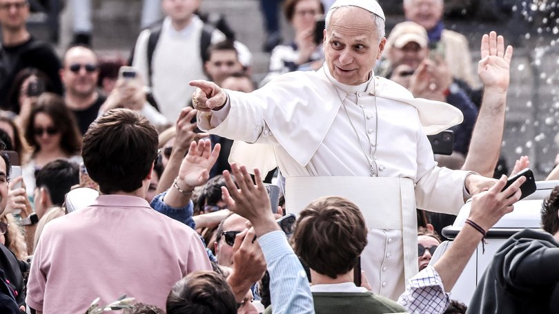 Pope Leo XIV greets the faithful at the end of the Palm Sunday Mass in St. Peter's Square.