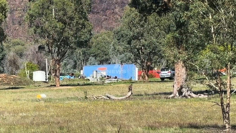 Dezi Freeman was found hiding out in a structure likened to a sea container on a remote property near the border of Victoria and NSW. 