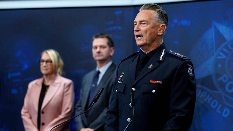 Victoria Police Chief Commissioner Mike Bush, right, with police officers involved in the investigation into Dezi Freeman, who was shot dead on Monday morning.