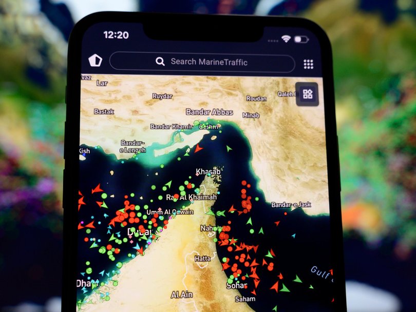 The MarineTraffic map shows a high concentration of ship beacons in the Strait of Hormuz.