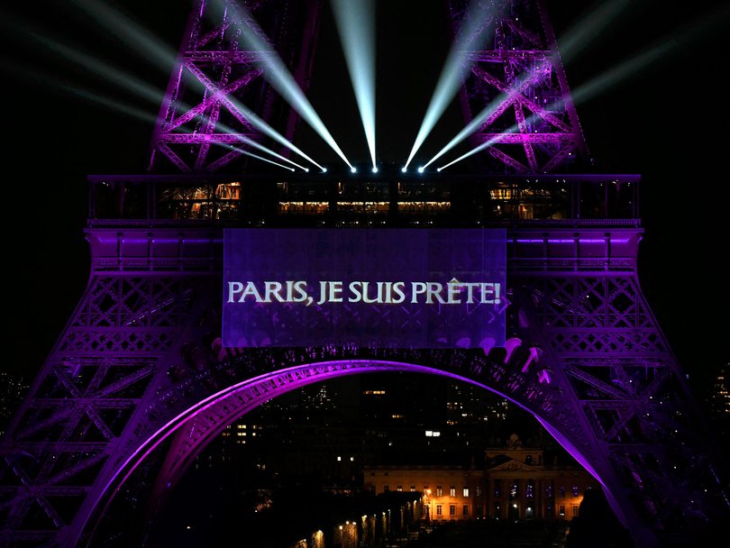 The slogan "Paris, I'm ready" is projected onto the Eiffel Tower as Canadian singer Celine Dion announces her concert comeback.