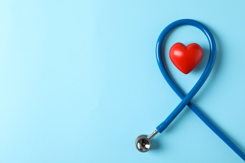 Stethoscope and heart on blue background, top view Picture: 