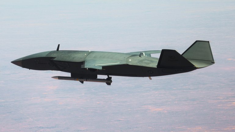 An MQ-28A Ghost Bat carries a medium range air-to-air missile near Woomera.