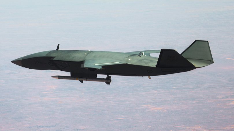 An MQ-28A Ghost Bat carries a medium range air-to-air missile near Woomera.