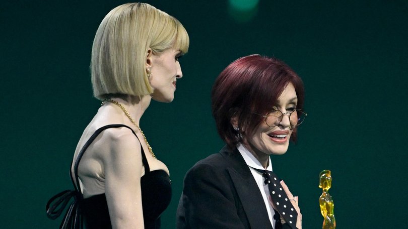 Kelly Osbourne and Sharon Osbourne accept the 'Lifetime Achievement' Award on behalf of the late Ozzy Osbourne on stage during The BRIT Awards 2026.