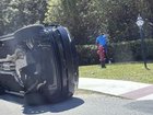 Tiger Woods stands by his overturned vehicle in Jupiter Island after last Friday's crash. 