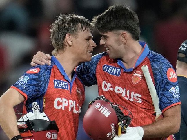 Cooper Connolly (left) and fellow Aussie Xavier Bartlett celebrate Punjab's victory over Gujarat.   (AP PHOTO)
