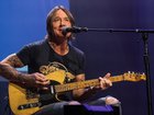 Keith Urban is reportedly 'in good spirits" and has been focusing his attention on his music. (AP PHOTO)