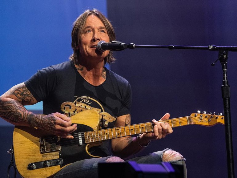 Keith Urban is reportedly 'in good spirits" and has been focusing his attention on his music. (AP PHOTO)