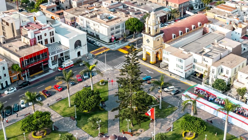 Flying with drone above La Punta del Callao in Lima, a small peninsula deep in the Pacific ocean with residential homes and beaches. 