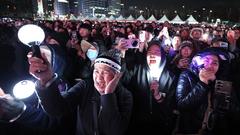 Fans of BTS cheer during their comeback concert in Seoul.