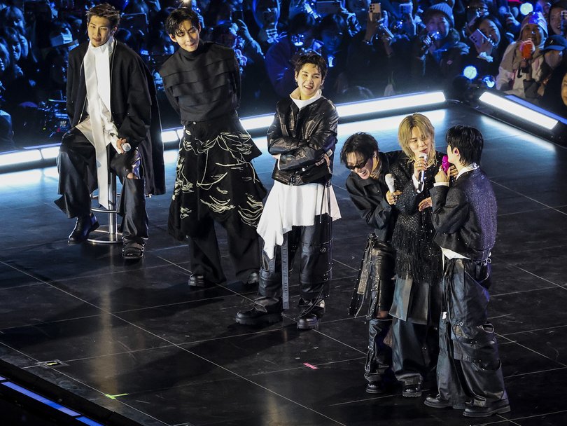 K-pop boy band BTS perform onstage during a comeback concert at Gwanghwamun Square in Seoul.