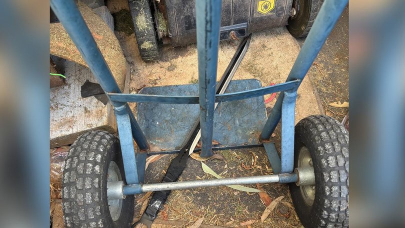A sword shown lying on a shed floor was seized by police days after two boys were stabbed to death. (PR IMAGE PHOTO)