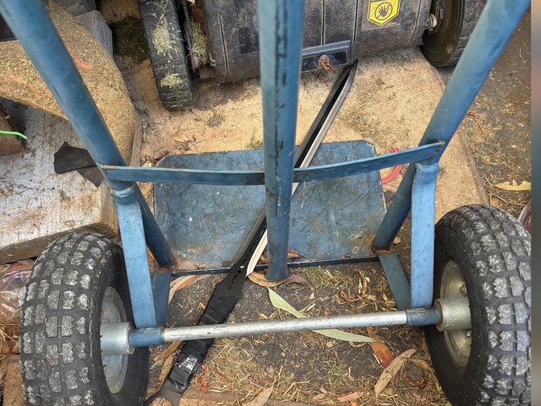 A sword shown lying on a shed floor was seized by police days after two boys were stabbed to death. (PR IMAGE PHOTO)