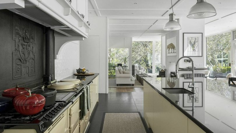 The chef's kitchen features an eight-door Aga, stone benches and a fully equipped butler's pantry.