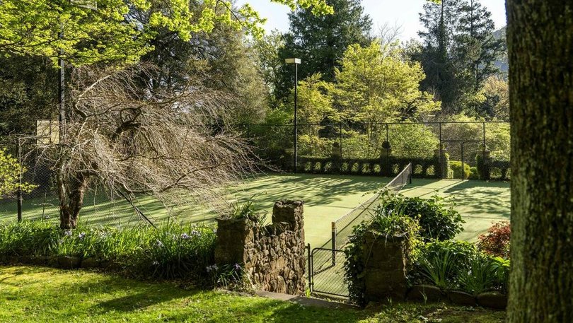 The mod-grass tennis court.