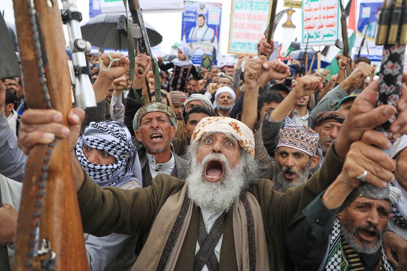 Houthi supporters shout slogans during a rally against Israel and the United States' war on Iran, in Sanaa, Yemen. 