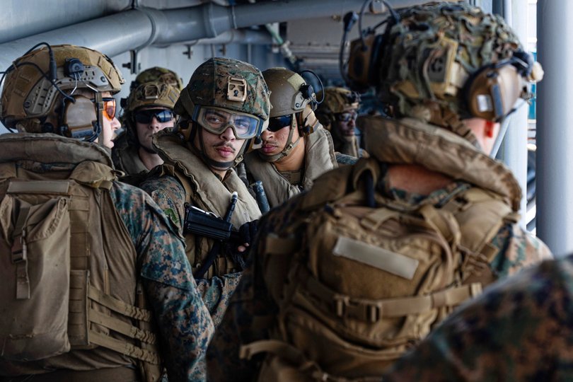 US sailors and Marines aboard USS Tripoli arriving in the Middle East.