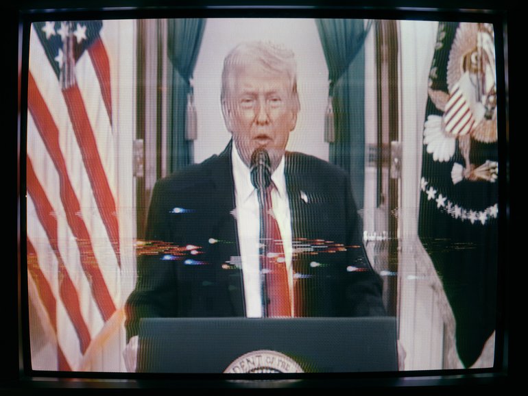 A monitor displays President Donald Trump as he delivers a message on the war in Iran in Washington, April 1, 2026. In a functioning American democracy, the president would deliver an Oval Office address at the start of a new military conflict. Donald Trump, however, decided to wait until a month into his war with Iran to give a speech about it to a skeptical public. (Jason Hendardy/The New York Times)