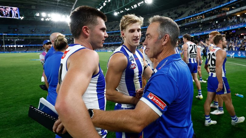 McKercher and Alastair Clarkson hug it out after the game.