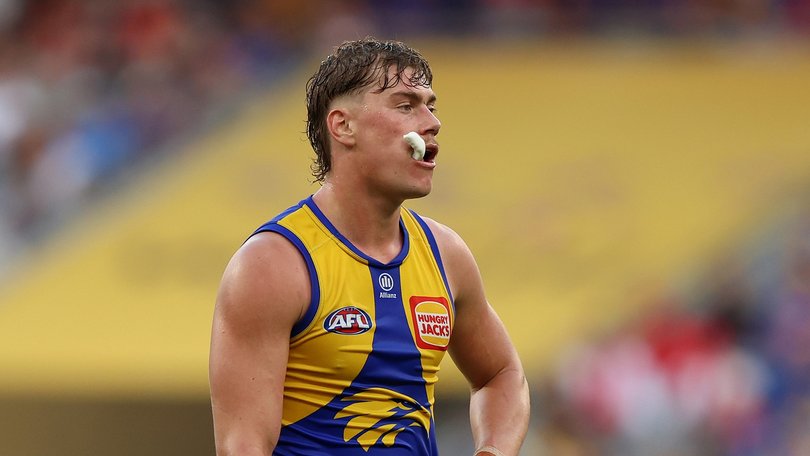 Harley Reid of the Eaglesl ooks on.