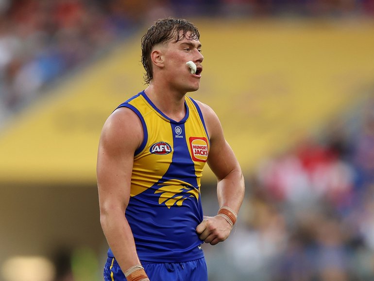 Harley Reid of the Eaglesl ooks on.