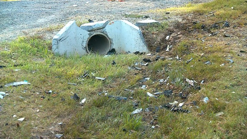 Debris lay scattered across the road after the crassh at Logan Reserve.