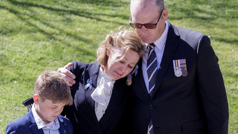Members of Detective Leading Senior Constable Neal Thompson’s family lay a wreath at the Melbourne National Police Remembrance Day march and service. NewsWire/David Geraghty
