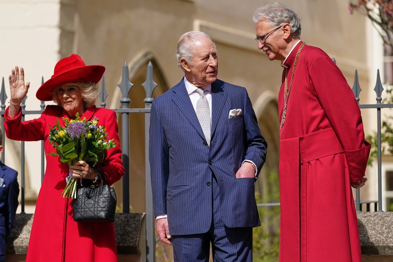 Britain's King Charles III and Queen Camilla talk to Reverend Christopher Cocksworth as they leave the Easter Matins Service at St. George's Chapel in Windsor, England.