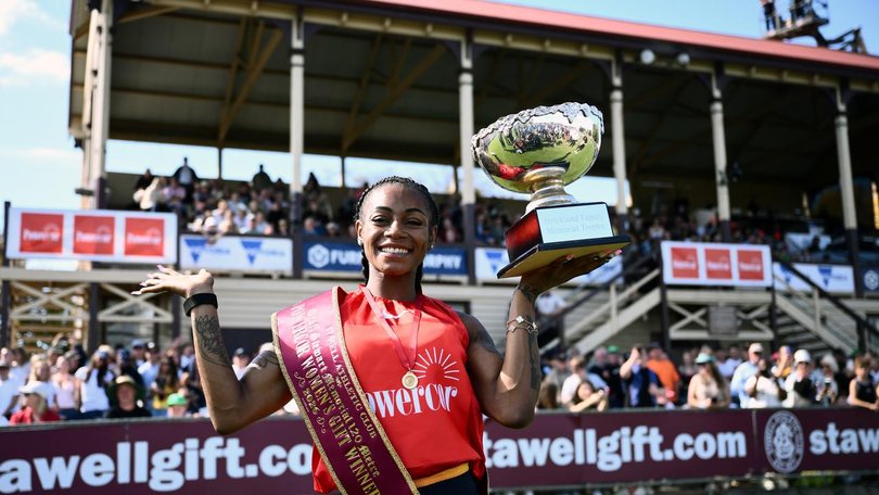 Sha'Carri Richardson with the spoils of victory at the Stawell Gift. (Joel Carrett/AAP PHOTOS)