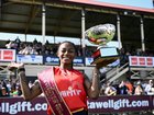 Sha'Carri Richardson with the spoils of victory at the Stawell Gift.  (Joel Carrett/AAP PHOTOS)