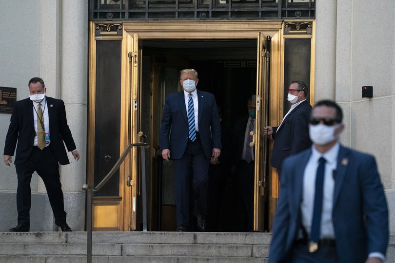 President Donald Trump walks out of Walter Reed National Military Medical Center after receiving treatment as a COVID-19 patient in 2020.