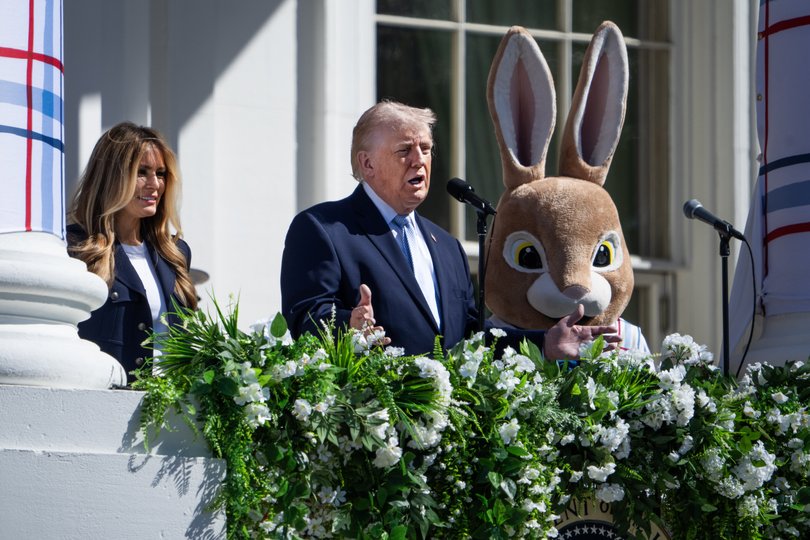 President Donald Trump and First Lady Melania Trump address the crowd on the South Lawn during the White House Easter Egg Rol.