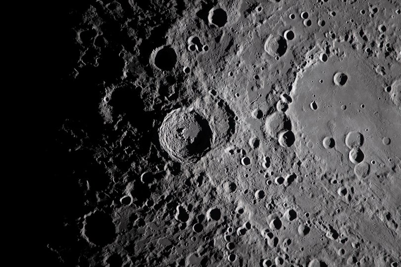 A photo provided by NASA shows a view of the Vavilov Crater, centre, and the older and larger Hertzsprung Basin, right, on the far side of the Moon.