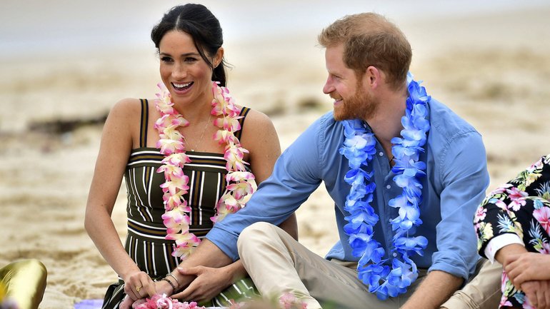 Harry and Meghan on the beach during their last visit to Australia.