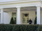 A Marine sentry stationed outside the West Wing, signifying the President was inside, at the White House on April 7.
