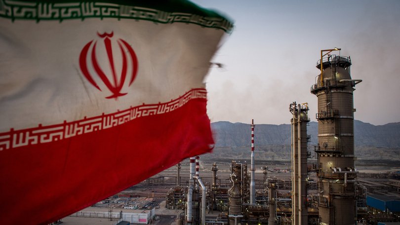 The Iranian flag flies at the Persian Gulf Star gas refinery in Bandar Abbas.